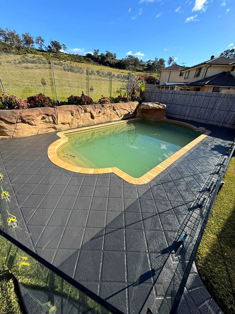 A cleaned residential driveway leading to a garage