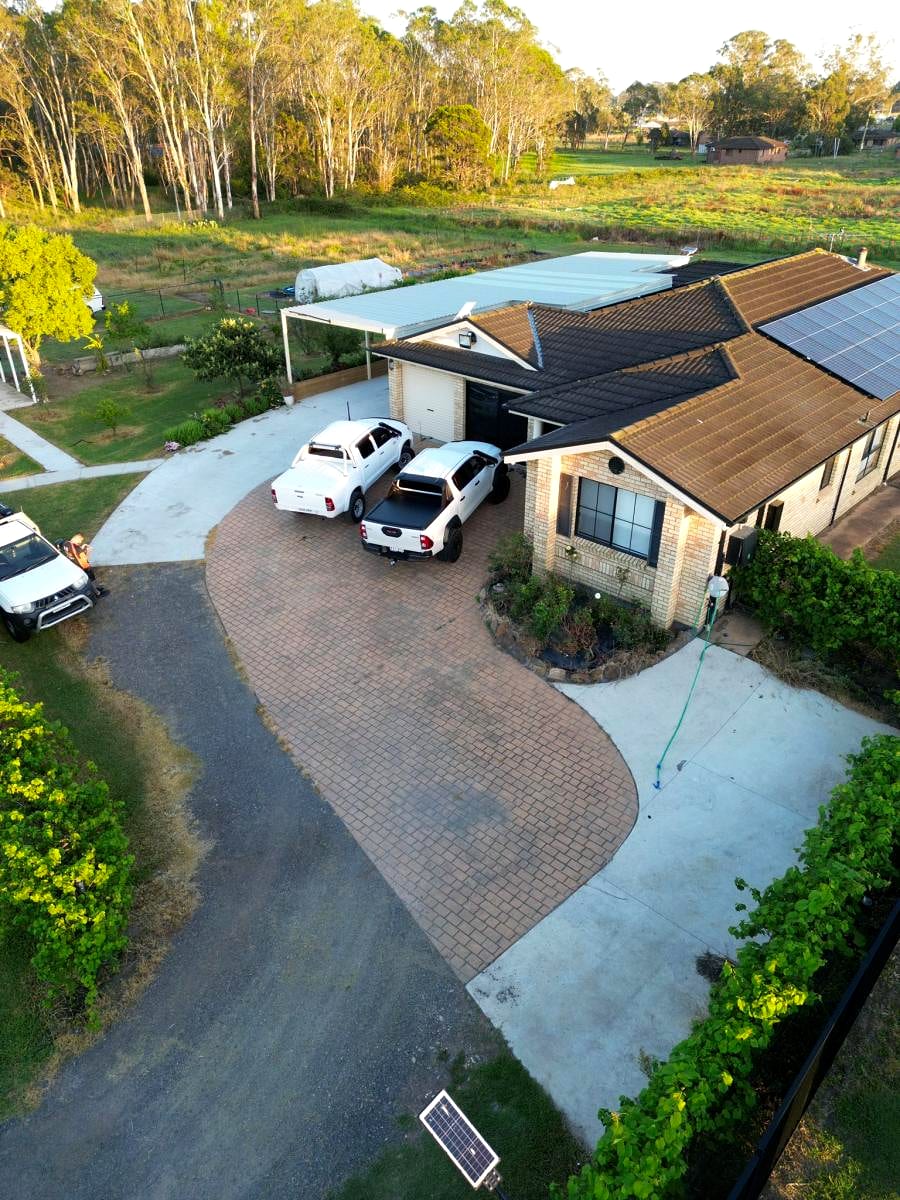 A concrete path after a fresh terracotta colour seal by On Demand, colour restored